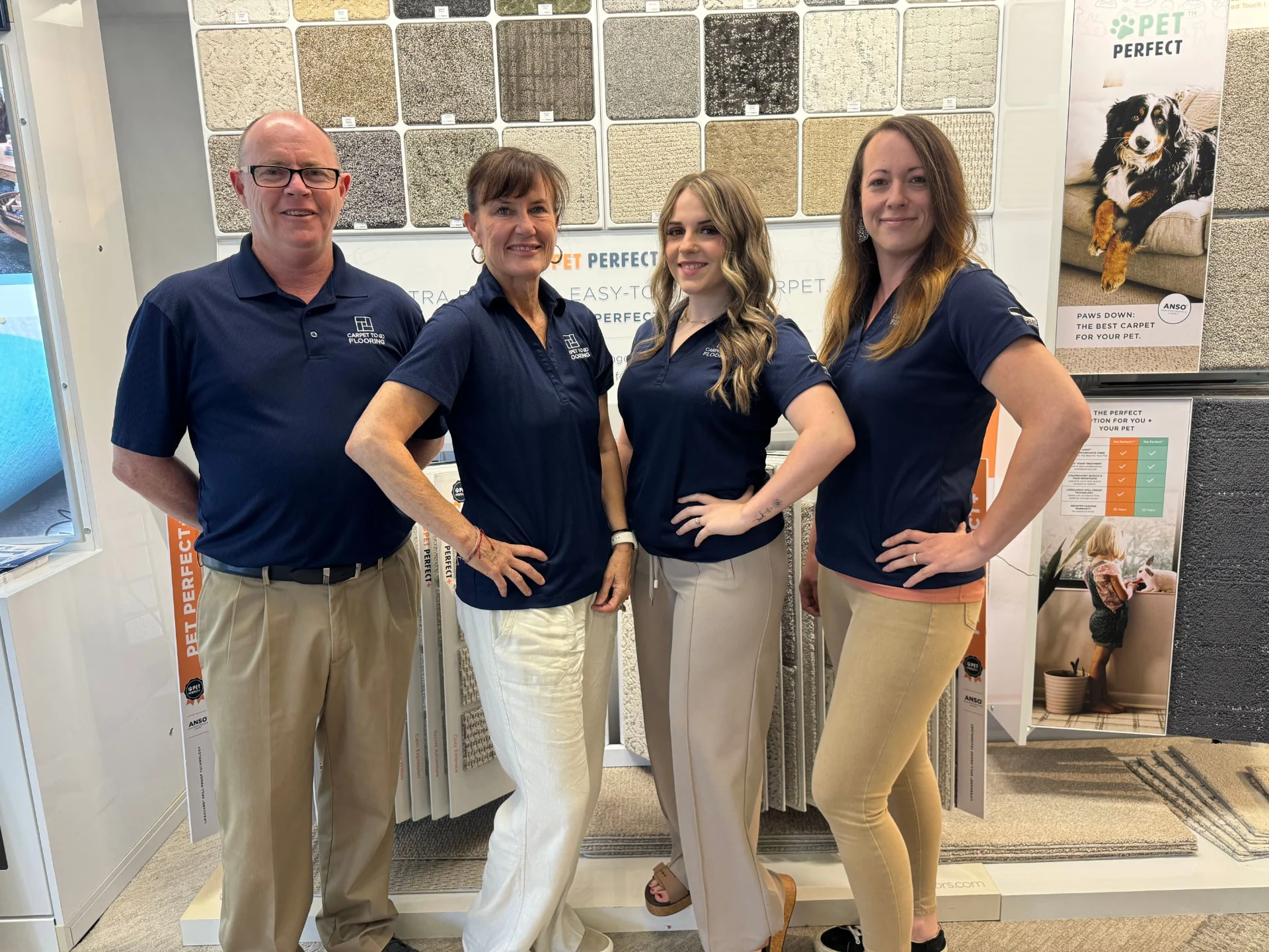 The Carpet To Go Flooring sales team in the North Charleston showroom