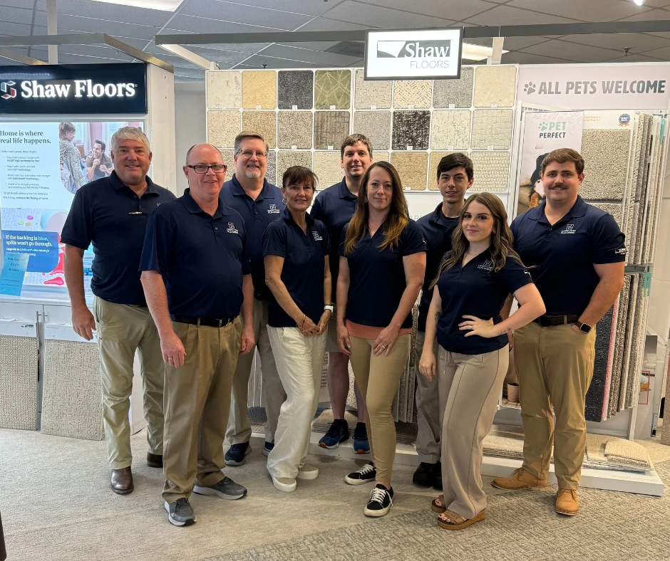 The Carpet To Go Flooring team inside the North Charleston showroom